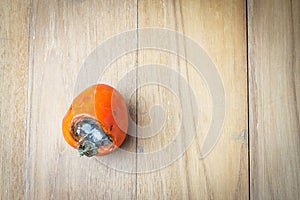 Tomato rod on wooden board with vintage tone