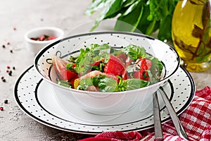 Tomato salad with basil and pine nuts in bowl - healthy vegetarian vegan diet organic food appetizer