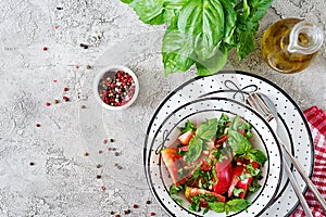 Tomato salad with basil and pine nuts in bowl - healthy vegetarian vegan diet organic food appetizer