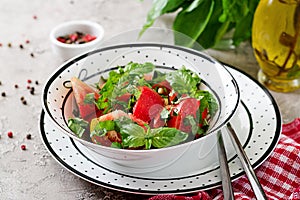 Tomato salad with basil and pine nuts in bowl - healthy vegetarian vegan diet organic food appetizer