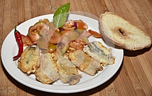 Tomato salad and fried anchovies