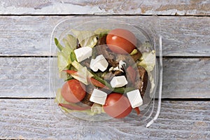 Tomato salad with lettuce, cheese. Greek salad, top view