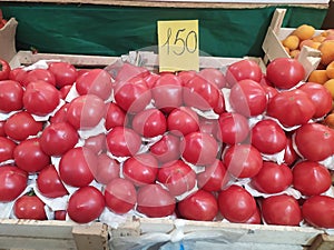 Tomato for sale in wooden box