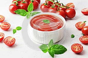 Tomato sauce in a bowl, Fresh basil and fresh cherry tomatoes.