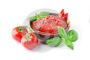 Tomato sauce in a bowl, Scented spice basil, Fresh ripe tomatoes, Chilli. Ingredient for the dish. Bowl full of tomato