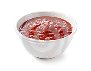 Tomato sauce in a bowl on a white background