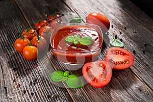 Tomato sauce and fresh tomatos photo