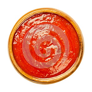 Tomato sauce with herbs, Neapolitan sauce, salsa roja, in wooden bowl photo