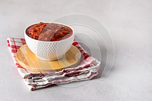 Tomato Sauce or Homemade Ketchup Healthy Vegetable Sauce in White Bowl on Wooden Tray Copy Space