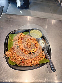 This is tomato sauce noodles with chatni of coconut