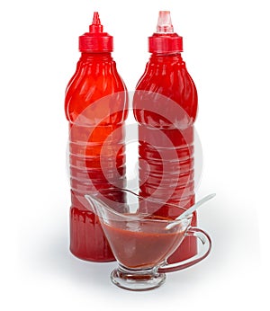 Tomato sauce in two plastic bottles and in gravy boat