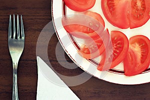 Tomato segments on a plate.Toning in vintage style.