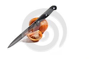 Tomato with sharp kitchen knife