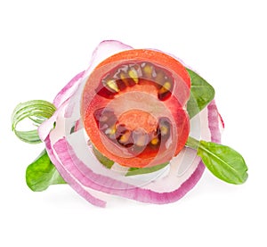 Tomato slice and leaf of basil