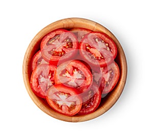Tomato slice in wood bowl isolated on white background
