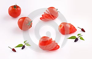 Tomato slices and pepper isolated on white background