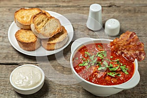 Tomato soup with bacon. European cuisine.