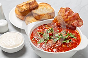 Tomato soup with bacon. European cuisine.