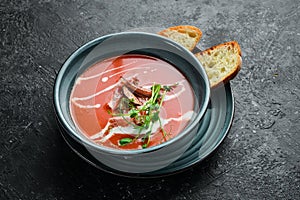 Tomato soup with bacon, onion and cream. Mexican cuisine.