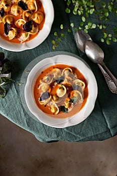 tomato soup with cappelletti pasta, cream and basil
