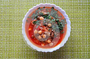 Tomato soup with chickpeas and vegetables. Arabic cuisine. Fast food in Ramadan.