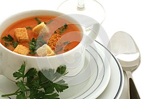 Tomato soup with croutons in ceramic bowl