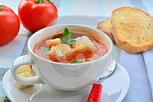 Tomato soup in white bowl