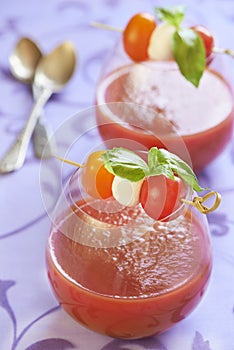 Tomato soup with mozzarella and basil