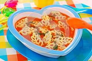 Tomato soup with pasta for child