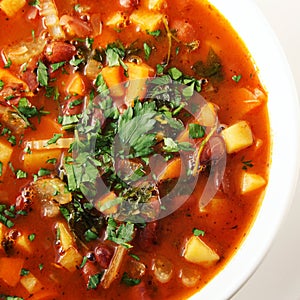 Tomato soup with red beans, potato and carrot.