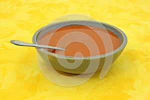 Tomato soup in stoneware bowl