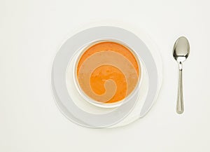 Tomato soup in white bowl