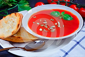 Tomato soup in a white plate