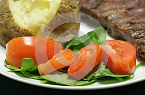 Tomato and spinach salad close up