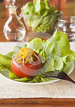 Tomato Stuffed with Beef and Vegetables Topped With Cheese