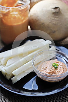 Tomato Tahini and Jicama Fries on plate vertical