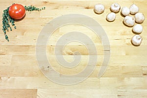 Tomato, thyme, and mushrooms on wooden board background. Healthy vegan, vegetarian, gluten free diet concept. Space for text.