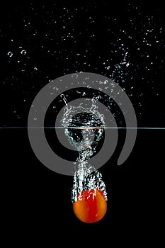 Tomato in water splash