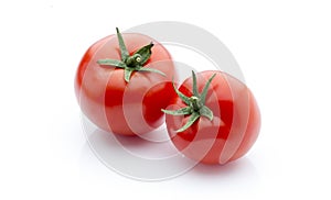 Tomato on the white isolatd background.