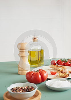 tomato and wooden pepper mill