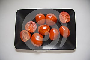 Tomatoes on black plate