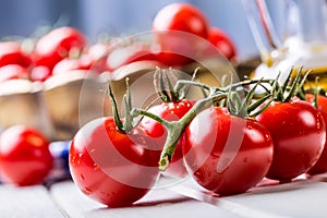 Tomatoes. Cherry tomatoes. Cocktail tomatoes. Fresh grape tomatoes carafe with olive oil