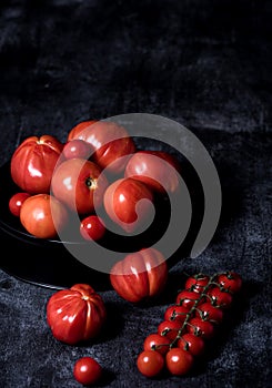 Tomatoes composition on black background