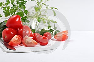 Tomatoes, cucumbers and parsley for cooking salad, Fresh summer vegetables on a bright sunny table with place for text, detox diet