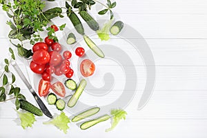 Tomatoes, cucumbers and parsley for cooking salad, Fresh summer vegetables on a bright sunny table with place for text, detox diet