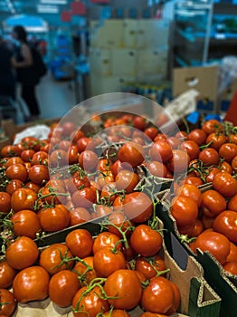 tomatoes displayed inside a supermarket photo