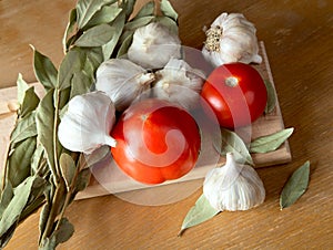 Tomatoes garlic and a bay leaf