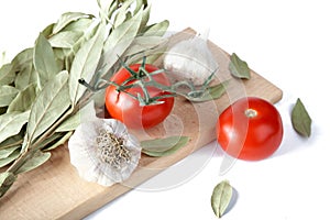 Tomatoes garlic and bay leaf branches