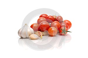 Tomatoes and garlic isolated on white background