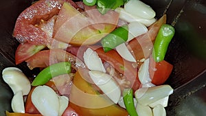 Tomatoes green chilies garlic in a grander food vegetables photography